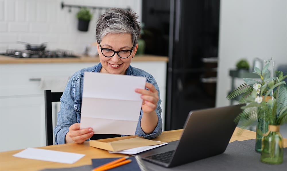 Smiling woman reading news